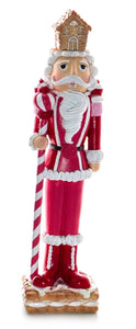 Nutcracker Holding Candy Cane with a Gingerbread House Hat