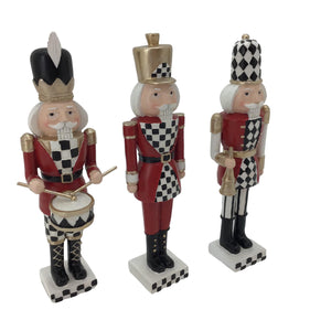Chequered Black, Red and White Solder Nutcracker Holding a Trumpet