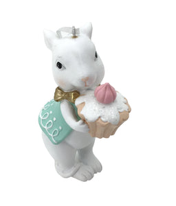 Bunny holding a Vanilla IcedCupcake