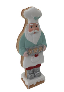 Santa Claus holding a tray of Gingerbreads