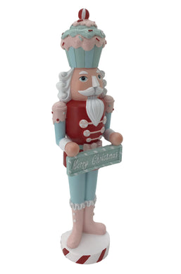 Candy Inspired Nutcracker wearing a Candy Cupcake as a Hat / Merry Christmas Sign