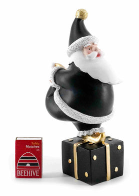 Blackand White Santa with Leg up standing on a Gift