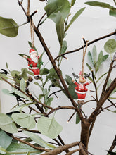 Load image into Gallery viewer, Reindeer Wearing Red and White Scarf Holding Bells